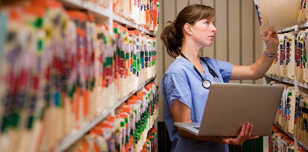 Nurse accessing medical records in a secure repository