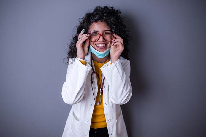Woman touching glasses