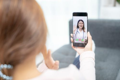 woman-using-a-phone-for-telehealth